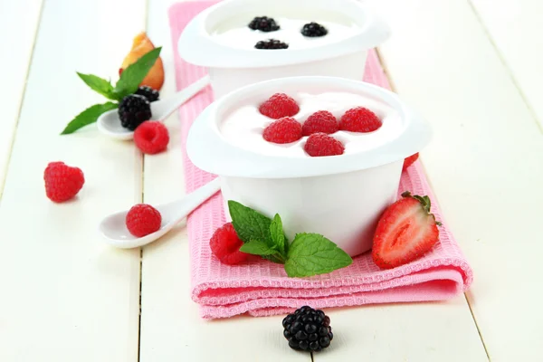 Delicious yogurt with fruit and berries on table close-up Stock Picture