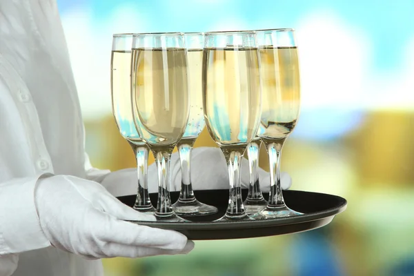 Waitresses holding tray with glasses of champagne — Stock Photo, Image