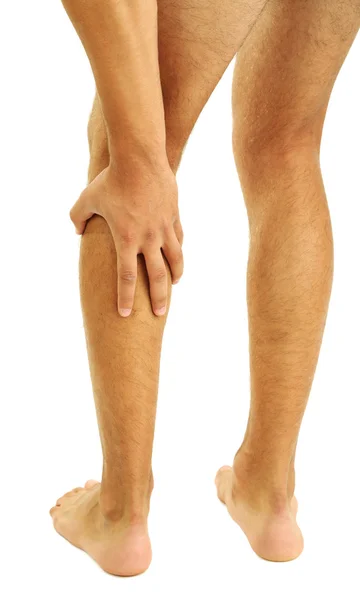 Young man with leg pain, isolated on white — Stock Photo, Image