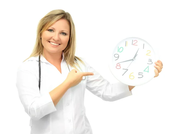 Young beautiful doctor with stethoscope and clock, isolated on white — Stock Photo, Image