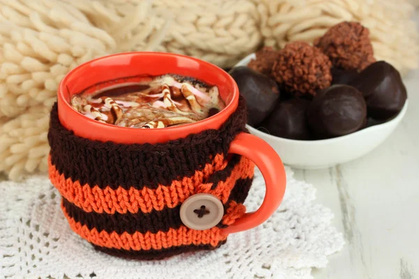 Cup with knitted thing on it close up — Stock Photo, Image