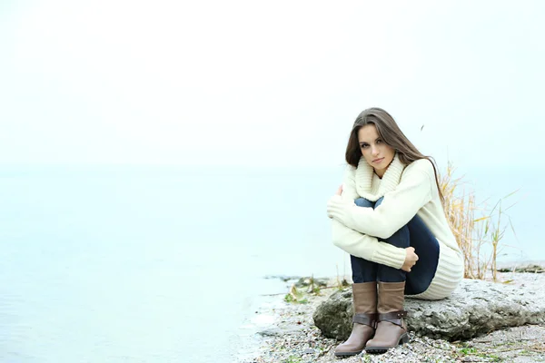 Portrait of young serious woman near river — Stock Photo, Image