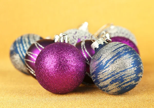 Christmas balls on yellow background — Stock Photo, Image