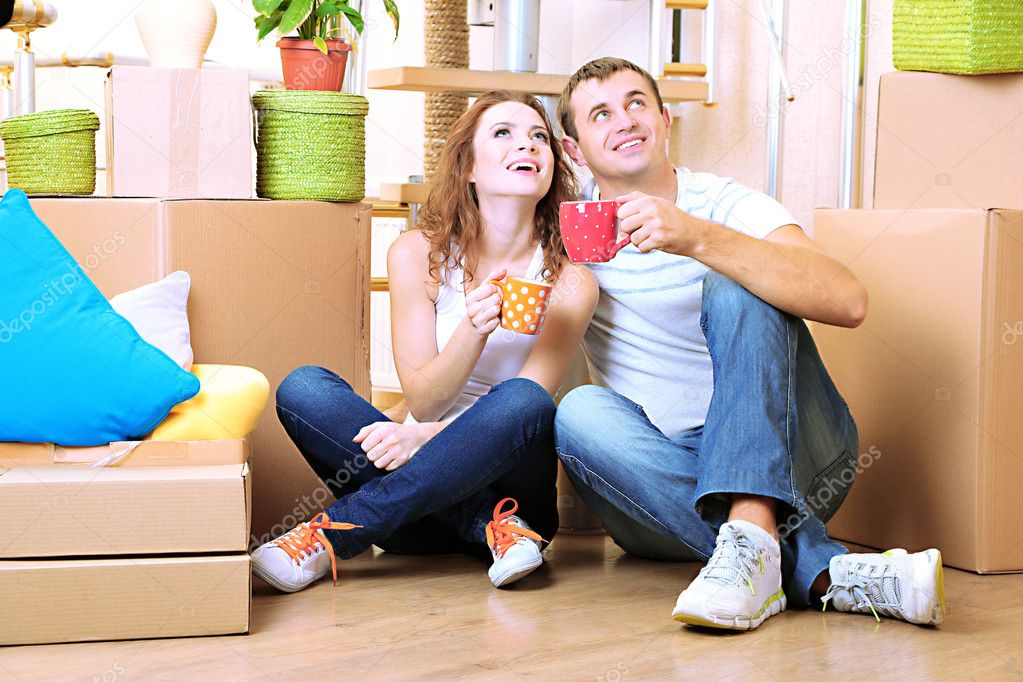 Young couple celebrating moving to new home