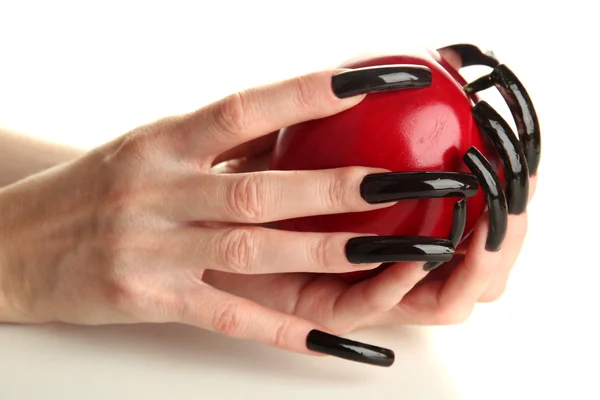 Mãos com manicure assustador segurando maçã vermelha, isolado em branco — Fotografia de Stock