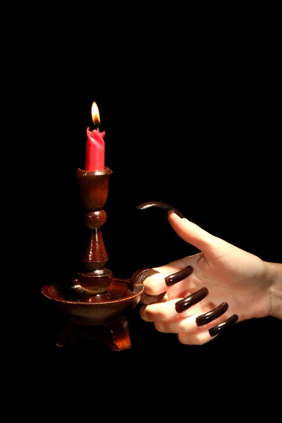 黒に分離の蝋燭と手します。 — ストック写真