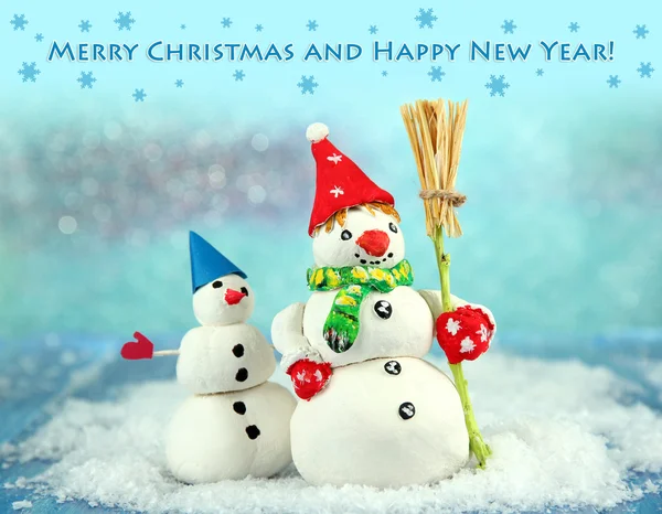 Beautiful snowmen and Christmas decor, on bright background — Stock Photo, Image