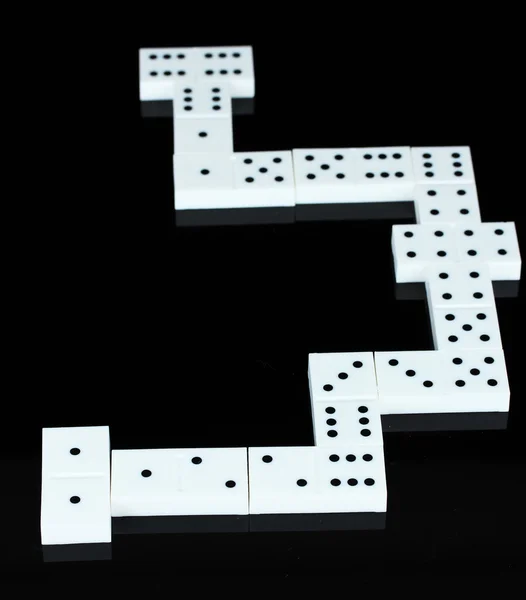 Domino isolerade på svart — Stockfoto