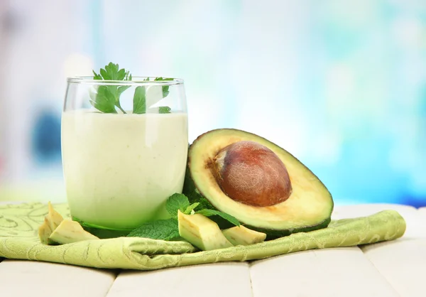 Fresh avocado smoothie on bright background — Stock Photo, Image