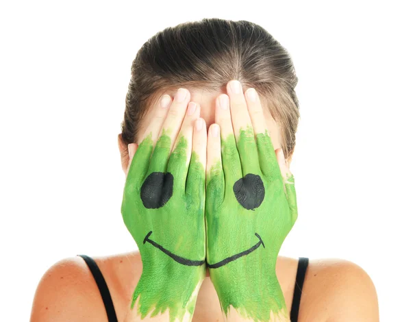 Portrait of girl hiding her face under smile mask isolated on white — Stock Photo, Image