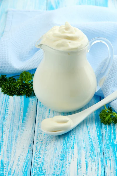 Sour cream in pitcher on table close-up — Stock Photo, Image