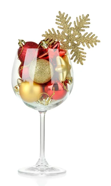 Wine glass filled with christmas decorations, isolated on white — Stock Photo, Image