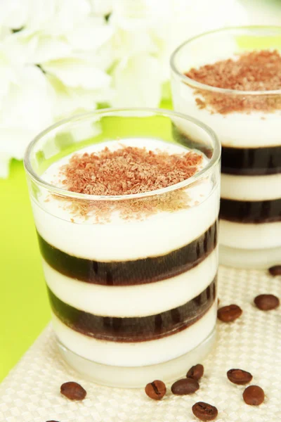 Tasty jelly coffee with milk on table on light background — Stock Photo, Image