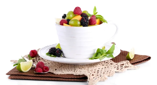 Fruit salad in cup on napkin isolated on white — Stock Photo, Image