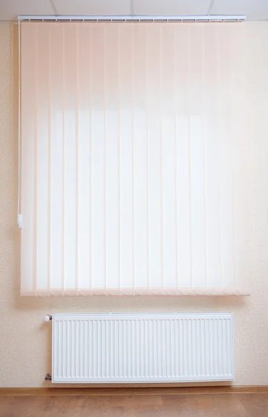 Photo heating radiator under window — Stock Photo, Image