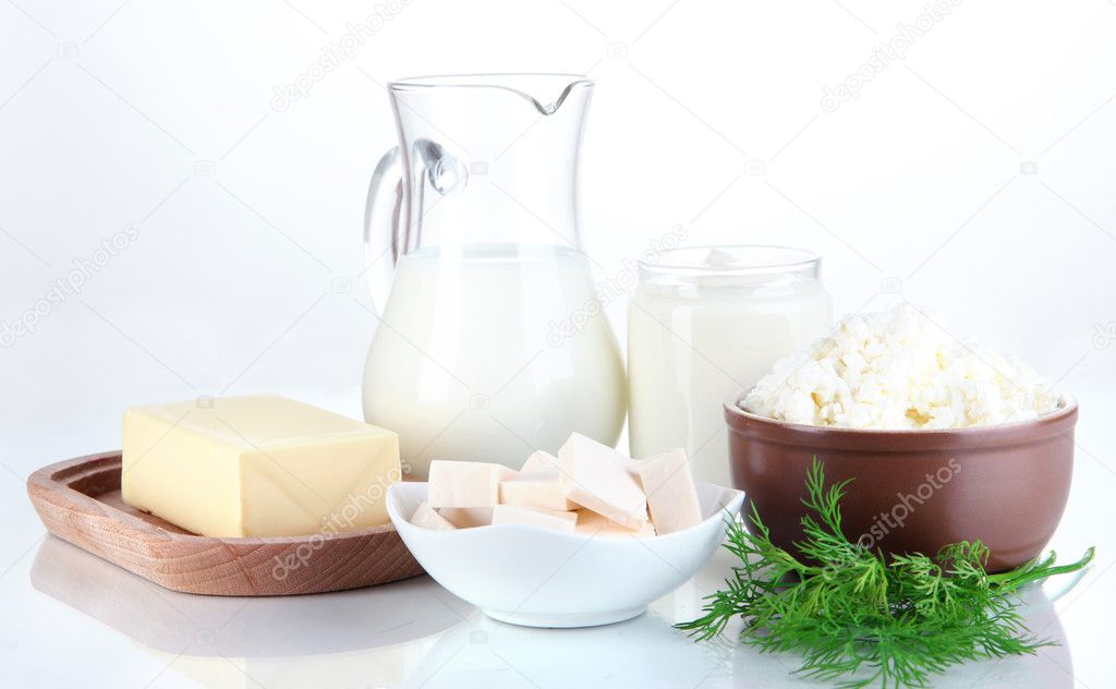Fresh dairy products with greens isolated on white