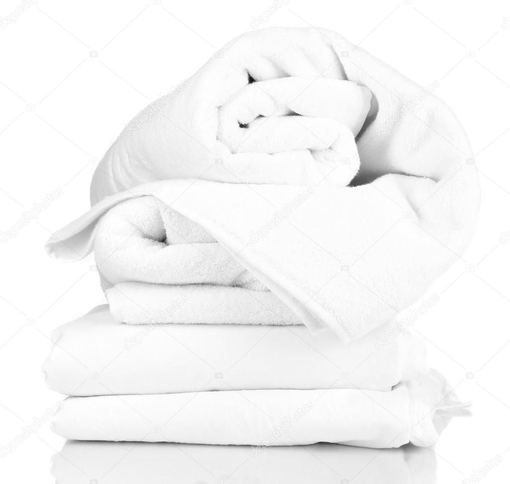 Stack of rumpled bedding sheets isolated on white — Stock Photo
