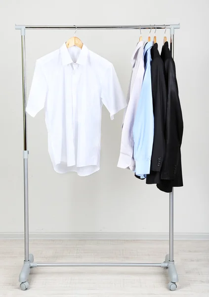 Office male clothes on hangers, on gray background — Stock Photo, Image