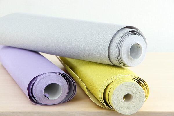 Wallpapers on wooden table in room