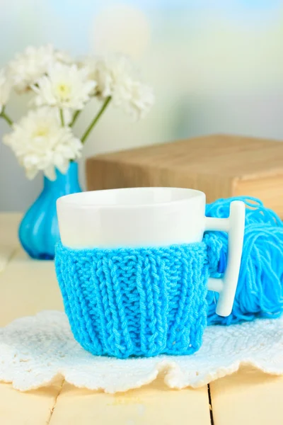 Cup with knitted thing on it close up — Stock Photo, Image