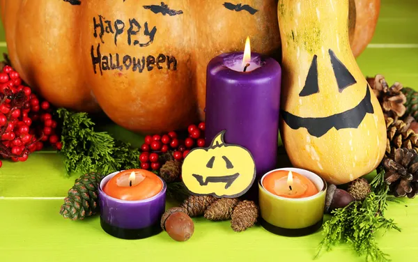 Composition for Halloween with pumpkins and candles close-up — Stock Photo, Image