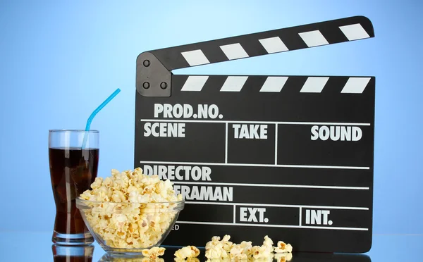 Movie clapperboard, cola and popcorn — Stock Photo, Image