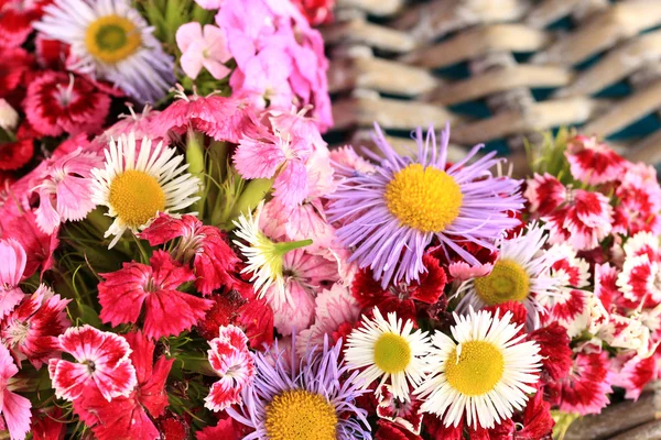 Wildflowers on wicker — Stock Photo, Image