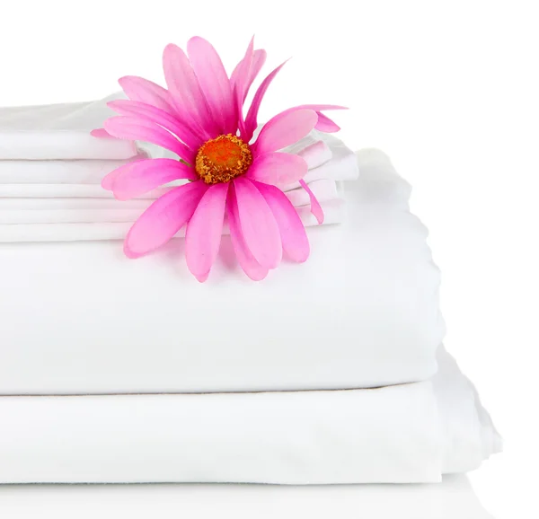 Stack of clean bedding sheets isolated on white — Stock Photo, Image