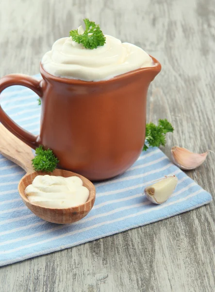 Sour cream in pitcher on table close-up — Stock Photo, Image