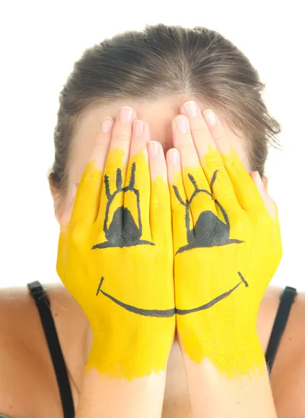 Portrait of girl hiding her face under smile mask isolated on white — Stock Photo, Image