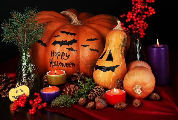 Composition for Halloween with pumpkins and candles close-up — Stock Photo, Image