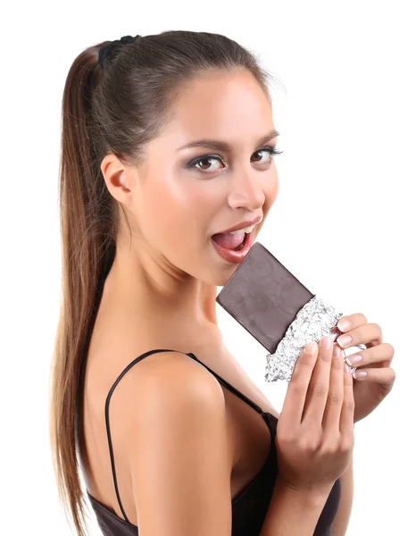 Portrait of beautiful young girl with chocolate isolated on white — Stock Photo, Image