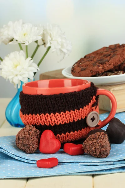 Cup with knitted thing on it close up — Stock Photo, Image