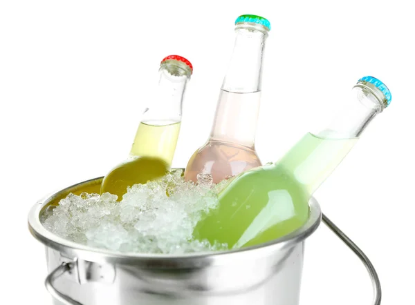 Bottled drinks in ice bucket isolated on white — Stock Photo, Image