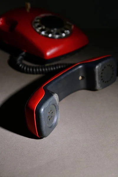 Red retro telephone on dark color background — Stock Photo, Image