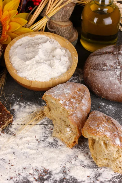 Rye bread on wooden table on wooden background close-up — Stock Photo, Image