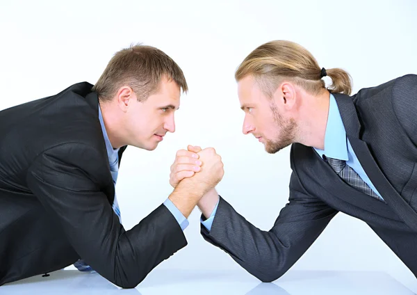 Arm wrestling of business people isolated on white — Stock Photo, Image