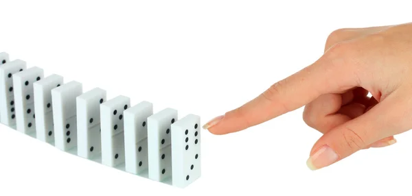 Hand pushing dominoes isolated on white — Stock Photo, Image