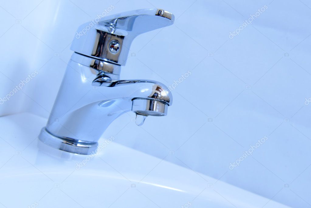 Close Up Of Human Hands Being Washed Under Faucet In Bathroom On