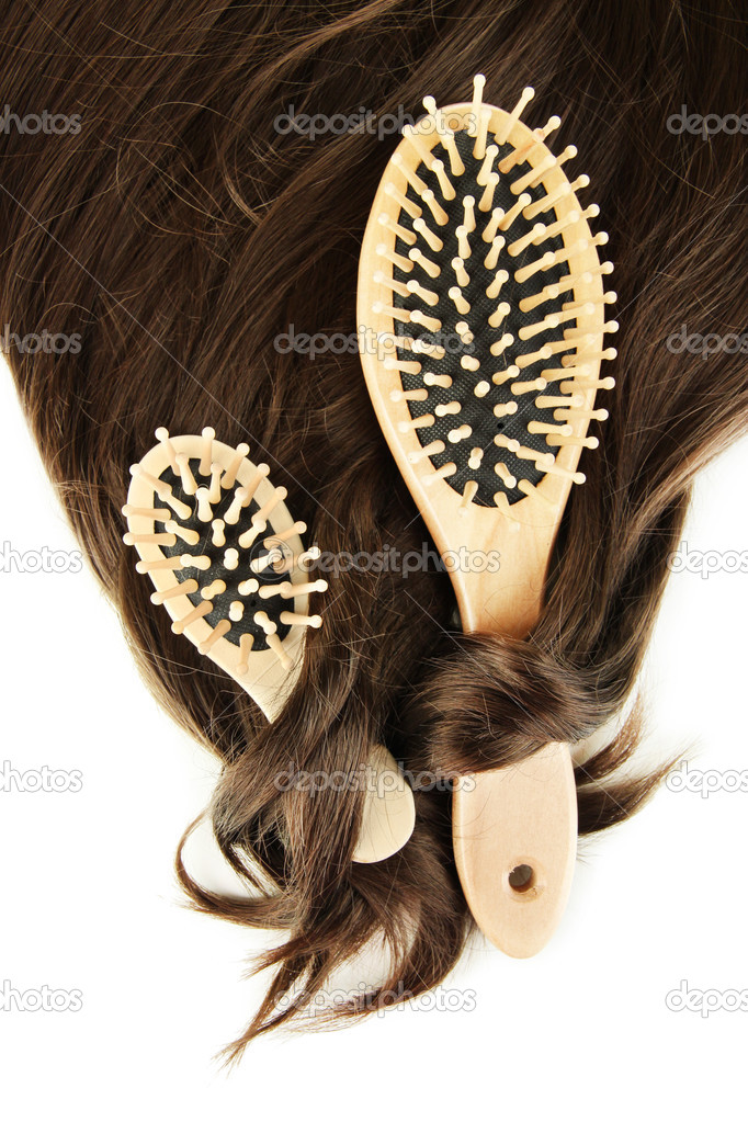 Shiny brown hair with combs isolated on white