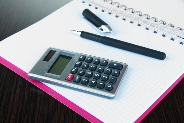 Notebook with pen and calculator close up — Stock Photo, Image