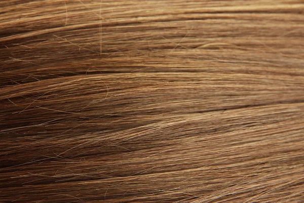 Shiny brown hair close-up background — Stock Photo, Image