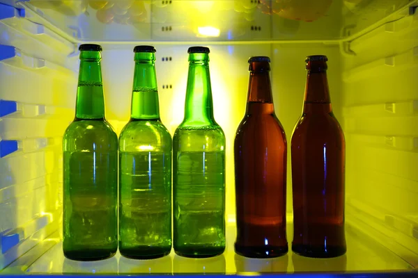 Bottles with drinks in refrigerator — Stock Photo, Image