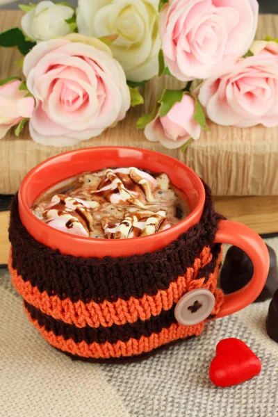 Cup with knitted thing on it close up — Stock Photo, Image