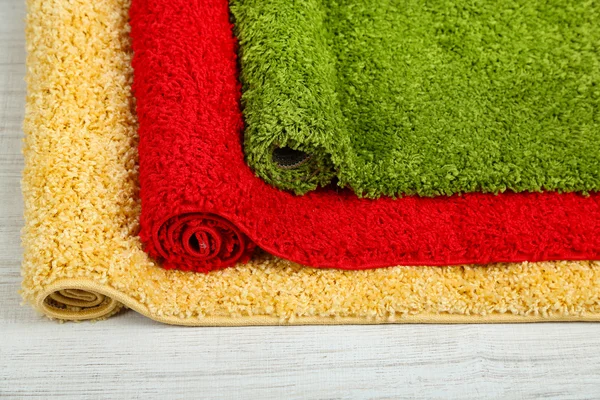 Many carpets of different colors close-up — Stock Photo, Image