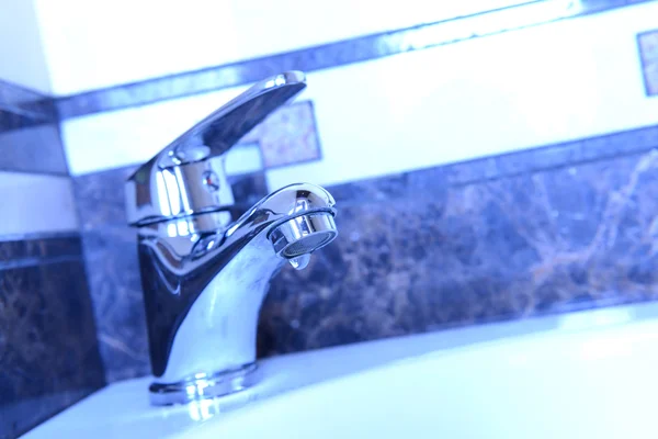 Ceramic sink with chrome fixture, close up — Stock Photo, Image