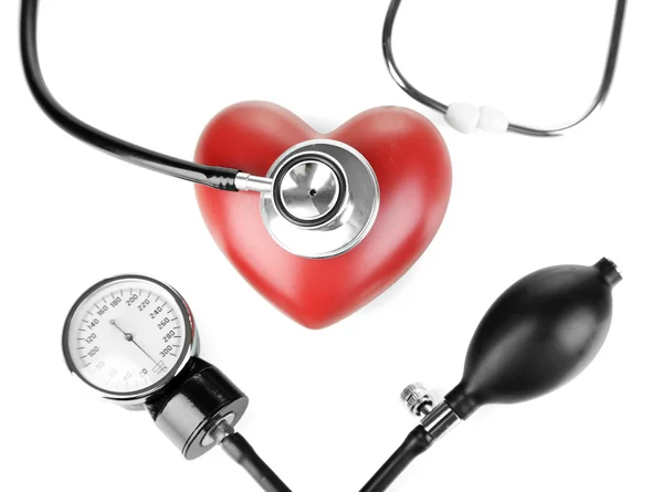 Tonometer, stethoscope and heart isolated on white — Stock Photo, Image