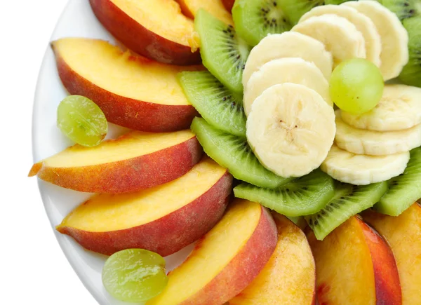 Assortment of sliced fruits on plate, isolated on white — Stock Photo, Image