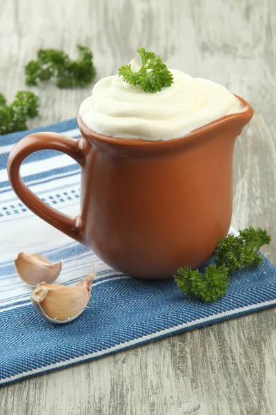 Sour cream in pitcher on table close-up — Stock Photo, Image