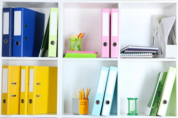 White office shelves with folders and different stationery, close up — Stock Photo, Image